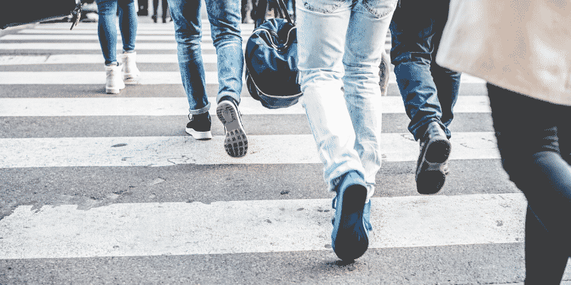 people-walking-across-street-at-crosswalk