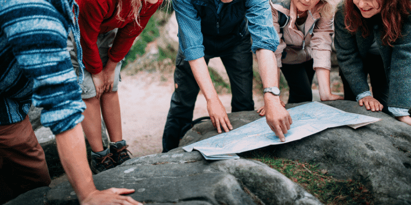 group-of-people-looking-at-map